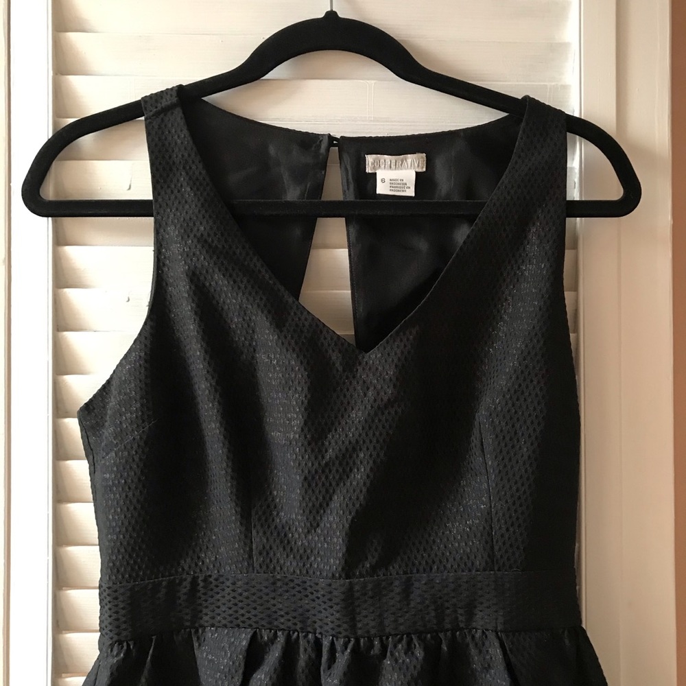 Urban Outfitters Black and Gold mini with cut out.